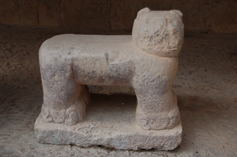 stone animal statue made in the shape of a dog