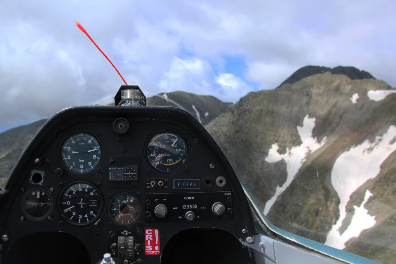 the inside of an airplane with two pilot controls