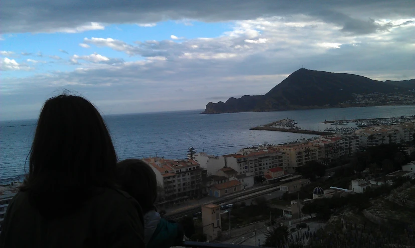 a person watching the water from a tower