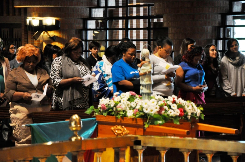 people are gathered in the pews at a wedding