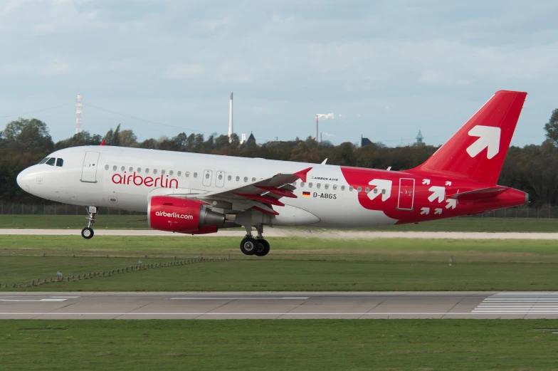 a large air plane taking off from an airport runway