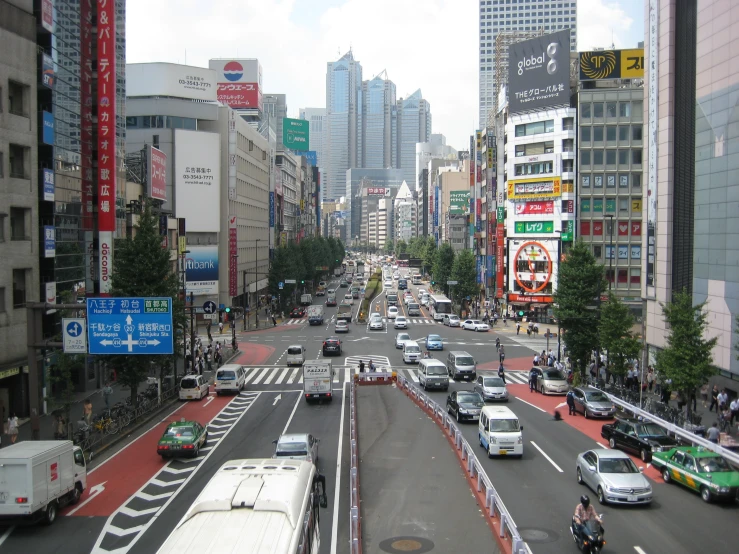 a city street with lots of traffic and tall buildings