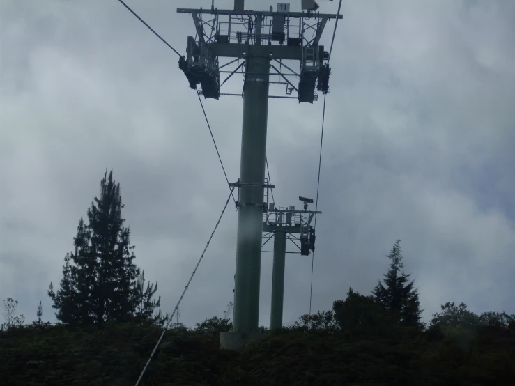 a view of a ski lift going up into the clouds