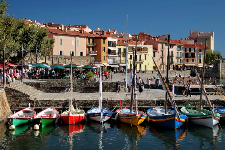 boats in the water in front of a city