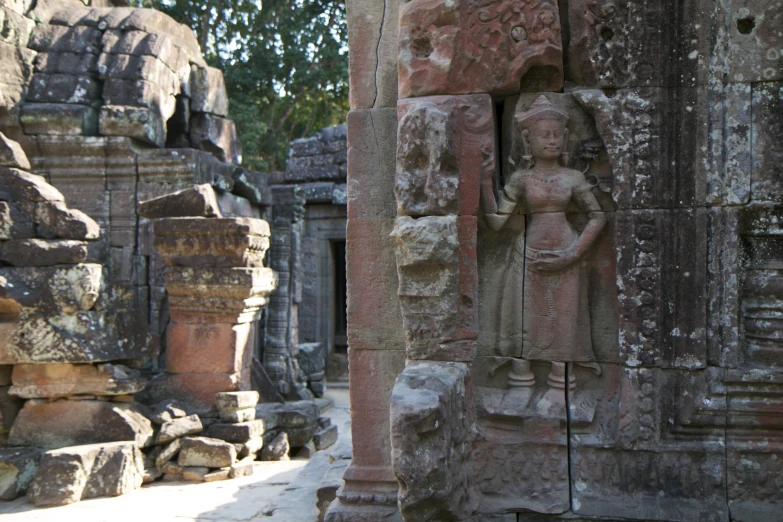 sculptures in a stone temple like structure made of rock