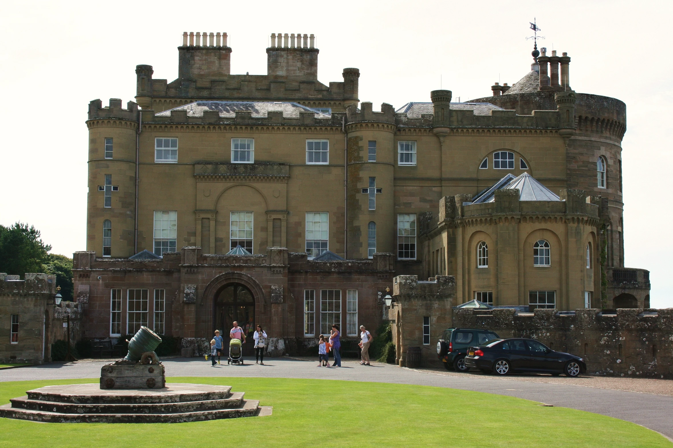 an old building with a car in front of it