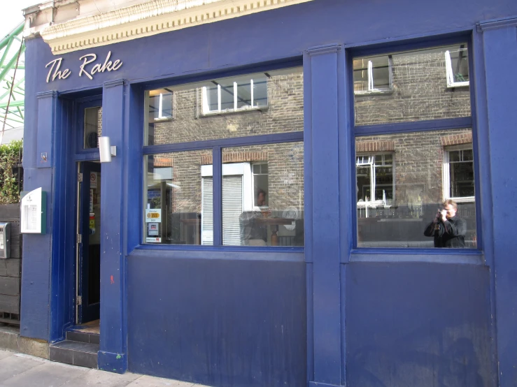 the front doors of a store on a city street