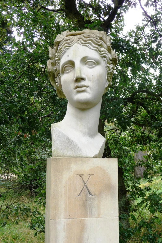 the statue depicts a woman's face with x marks