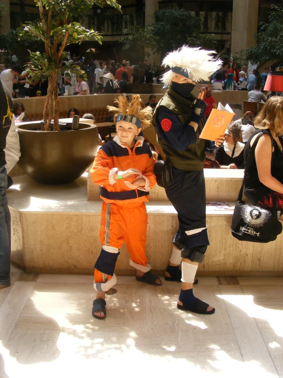 some people with costumes on standing in the shade