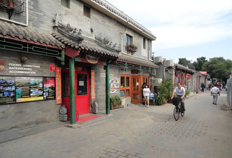 people walking, cycling, and biking through a city