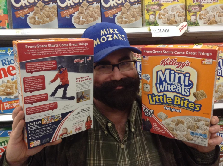 a man holding up cereals and cereal boxes in a store