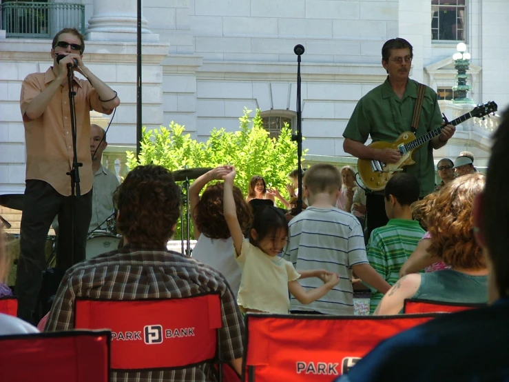 there are two people that are playing guitars