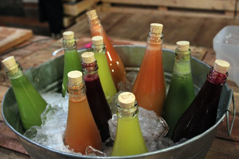 an ice bucket full of wine bottles are displayed