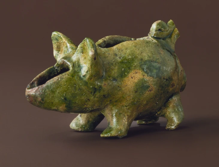 a ceramic sculpture in the shape of a dog