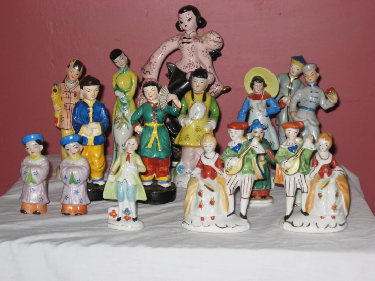 a collection of ceramic figurines are on display