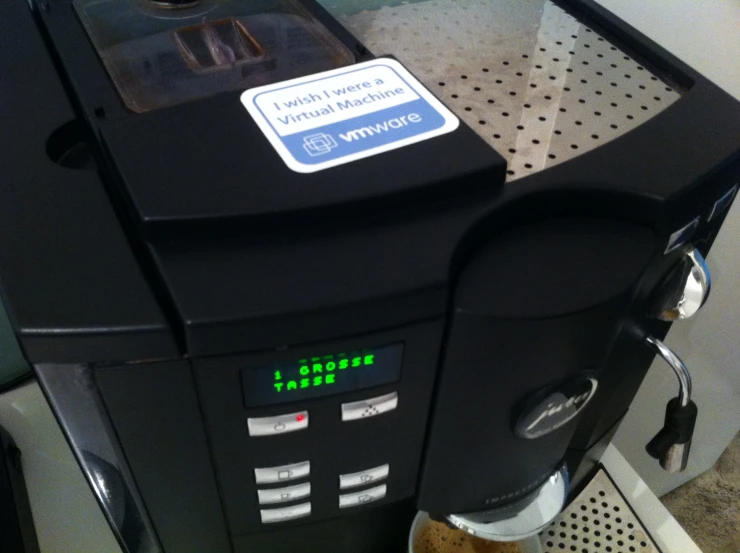 a black electronic machine with a clock showing time