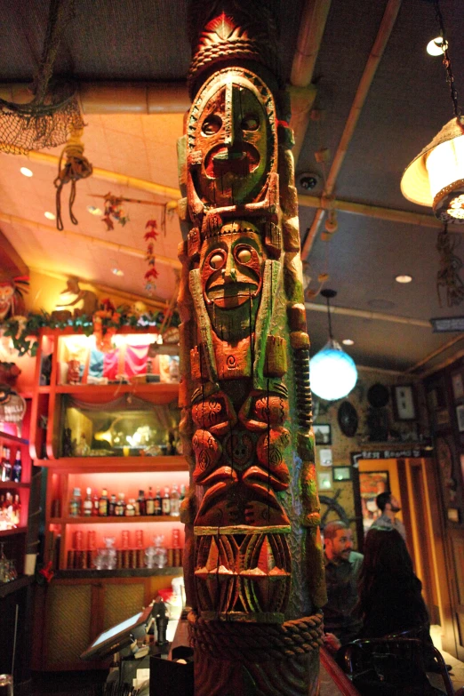 a close - up of the pole inside of the bar with many pictures on it