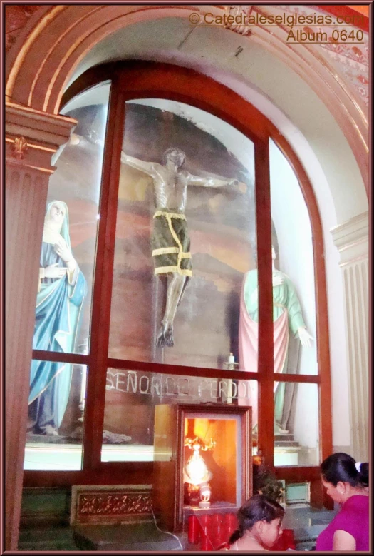 the inside of a church with a crucifix