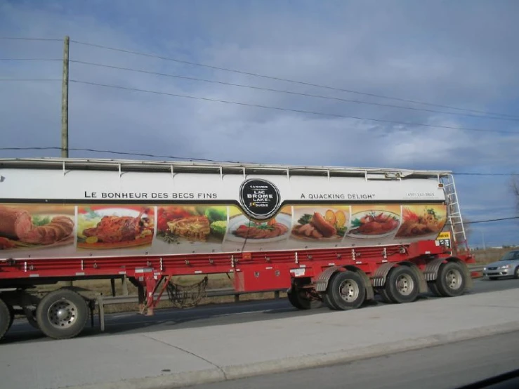 a large semi truck is hauling a food trailer