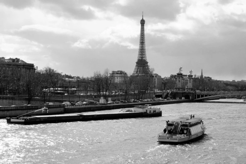 a black and white po of a boat traveling down the water