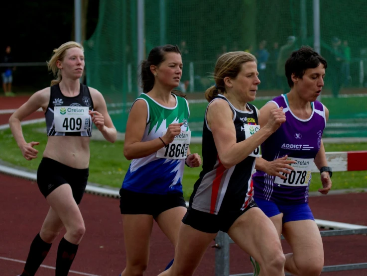 a group of women racing a race on a track