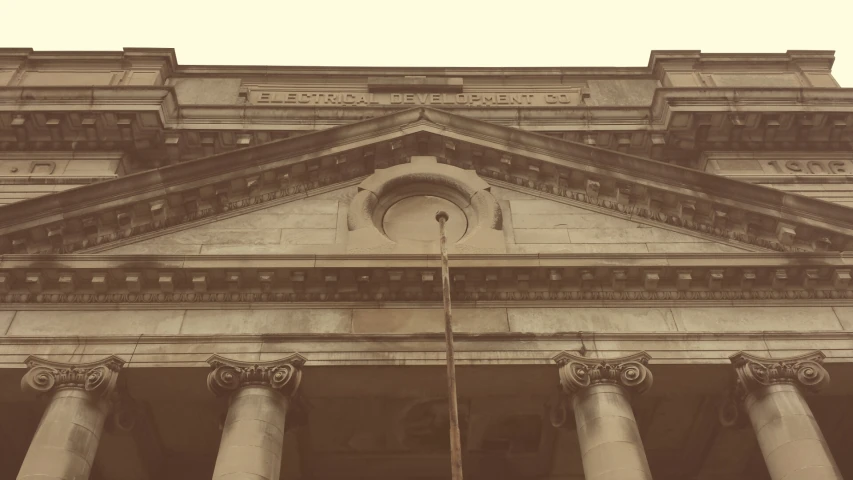 the building has columns and a flagpole