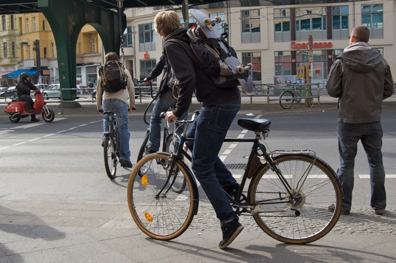 a woman with her bike waiting for another person