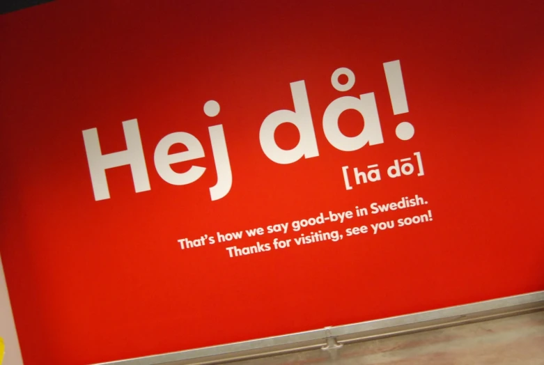 a red wall with the words hey dad