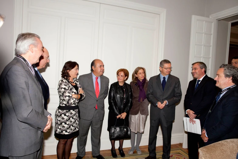 a group of people standing in a room