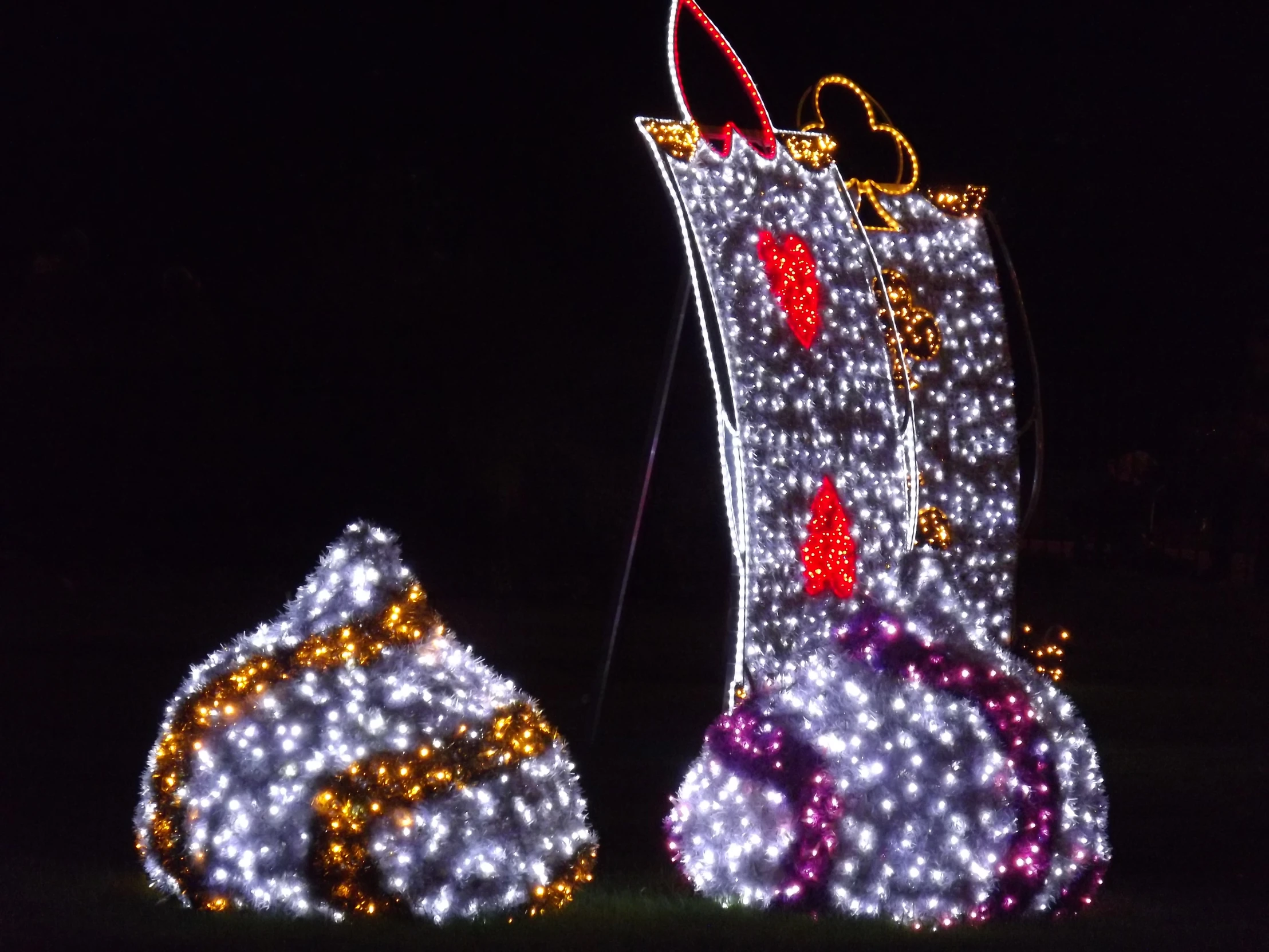 several christmas lights all around a tall boot and one large