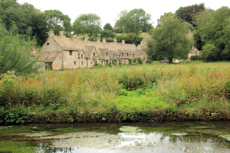 a large house in the middle of a field