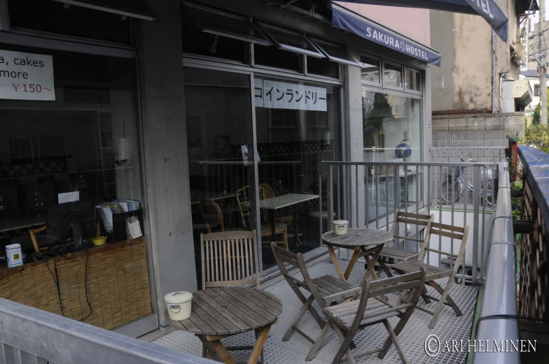 a bunch of old wooden furniture on the outside of a building