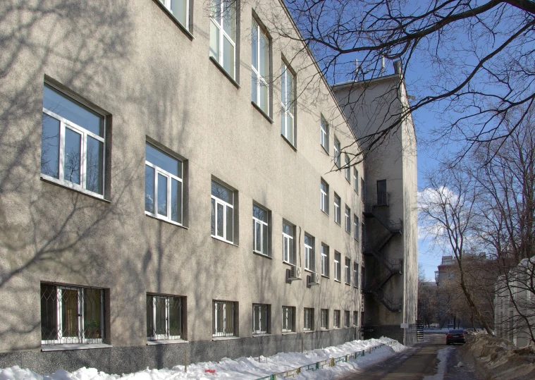 a building in the snow on the street