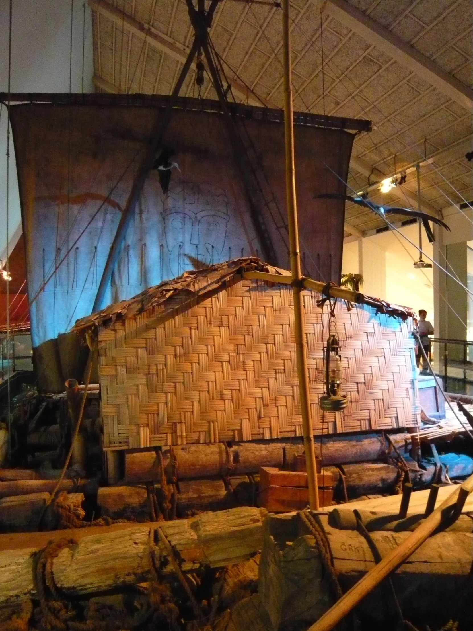 a large ship sitting on top of a pile of wooden logs