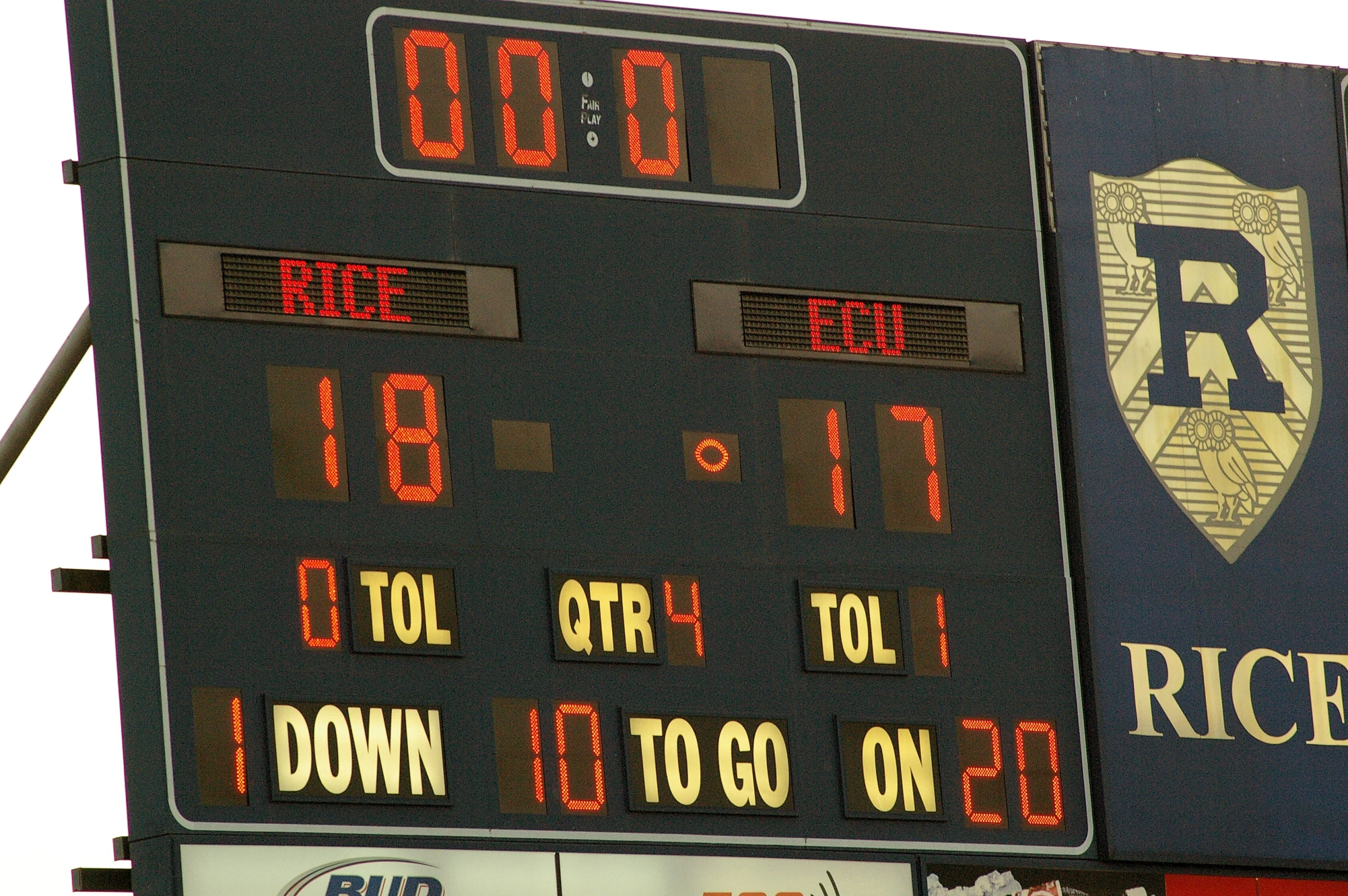 the scoreboard for rice university's stadium stands in front of the scoreboard