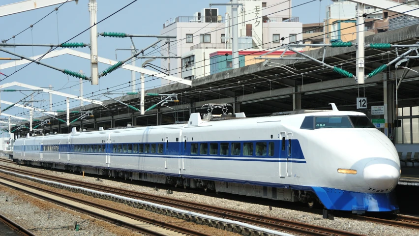 a high speed train is on the railroad tracks