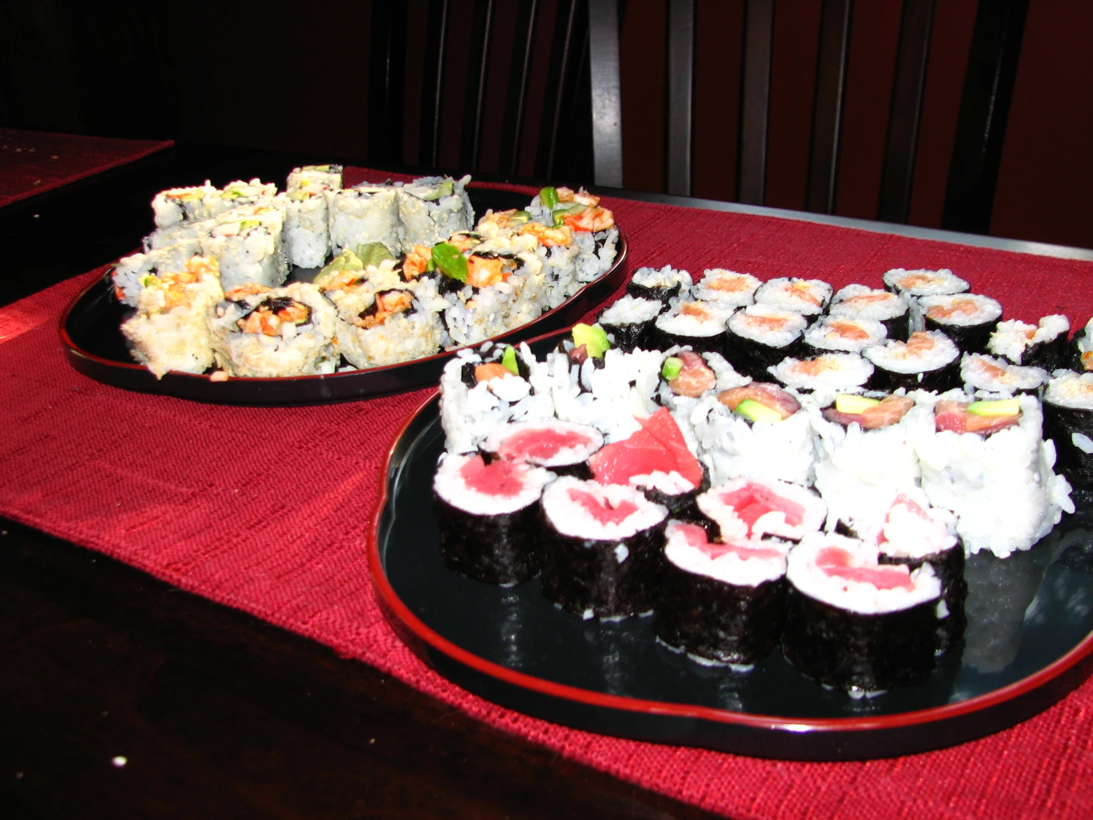 a buffet style platter of assorted sushi rolls