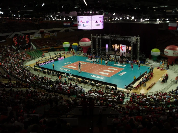 a tennis court full of fans and spectators