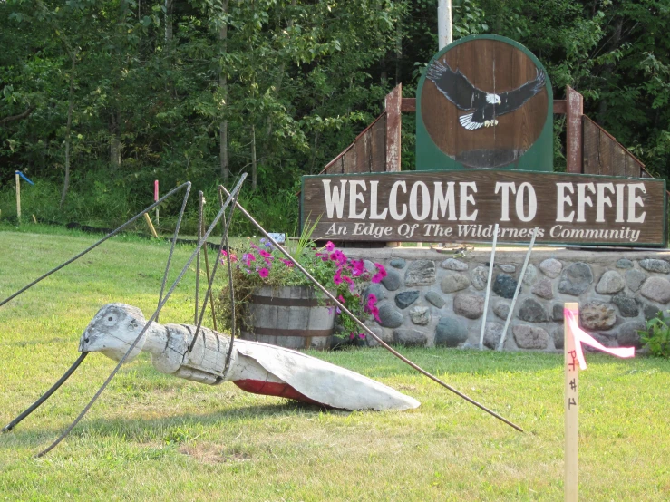 a welcome sign to effiee park and the village community