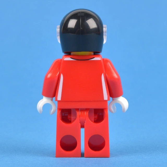 a lego man standing against a blue background