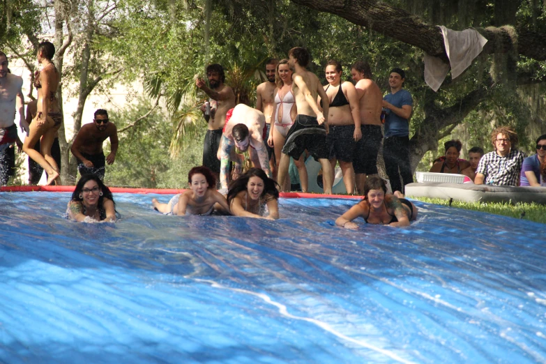 a large group of people swimming in a pool