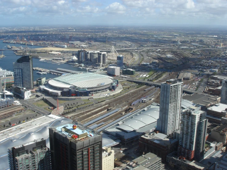 an aerial view of a train track next to some buildings