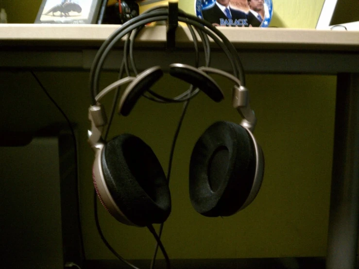 headphones and a picture of a woman on a table