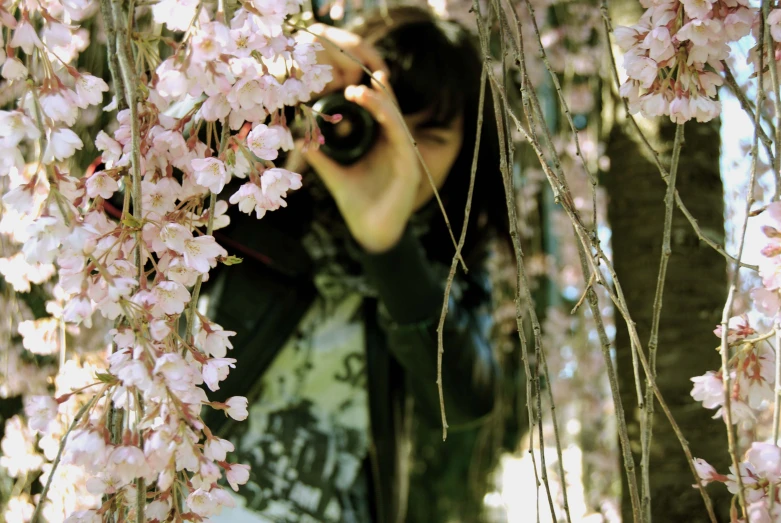 a woman with a camera taking a picture