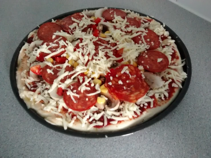 the pizza is covered with cheese and toppings