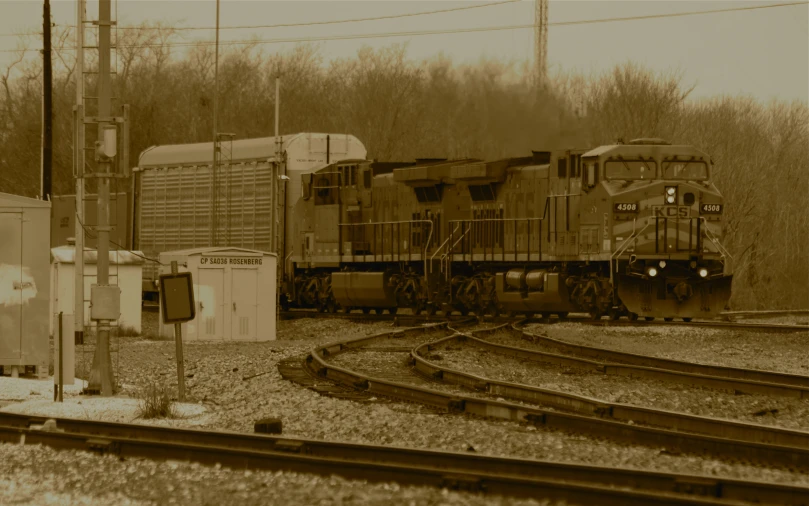 a train coming down the tracks, on a snowy day