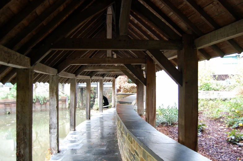 a person walking up a wooden walkway next to water