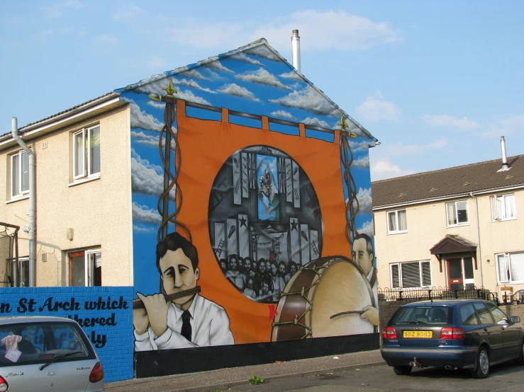 mural of a man holding a clock on the side of a building