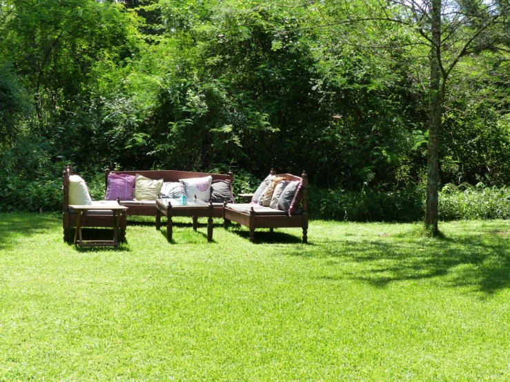 chairs sitting in the grass on a sunny day