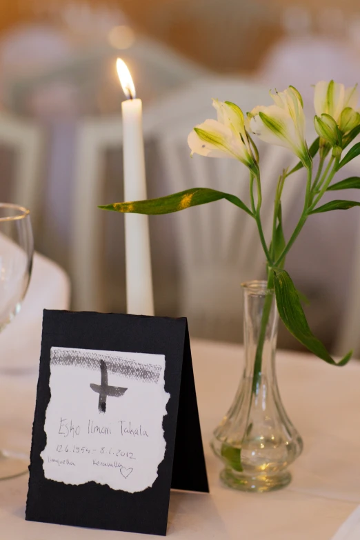 a place setting with flowers and candle